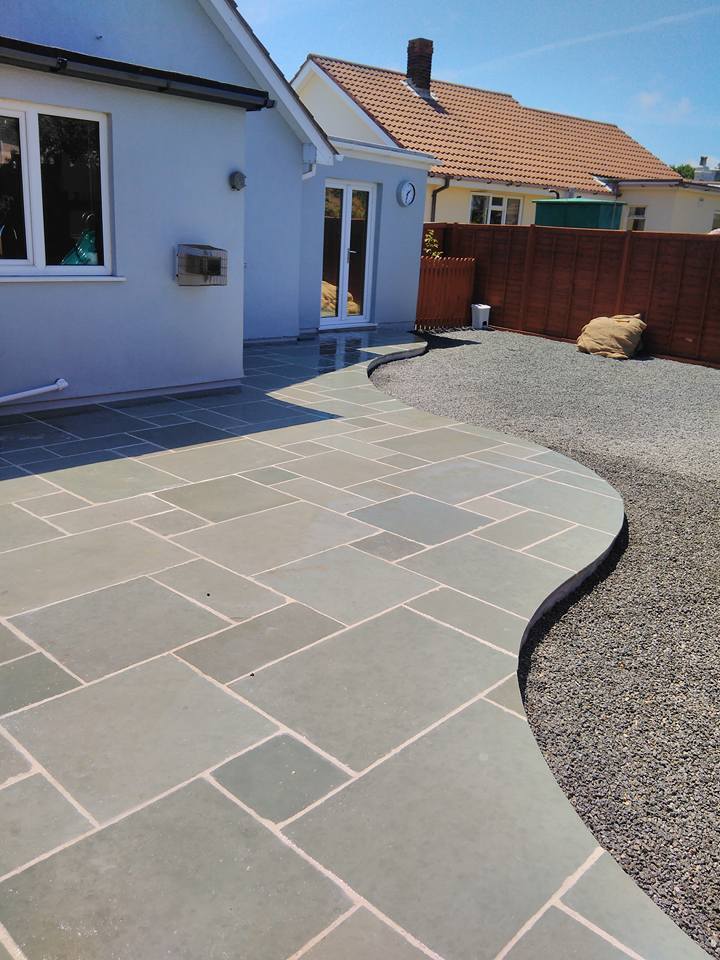 Stonemasonry bespoke stone paving that is cut in a curve shape.