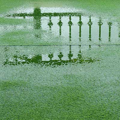 Flooded artificial grass that shows what happens when you don't properly fit artificial grass