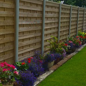 Guernsey garden fencing header photo of a beautiful wooden fence with concrete posts.